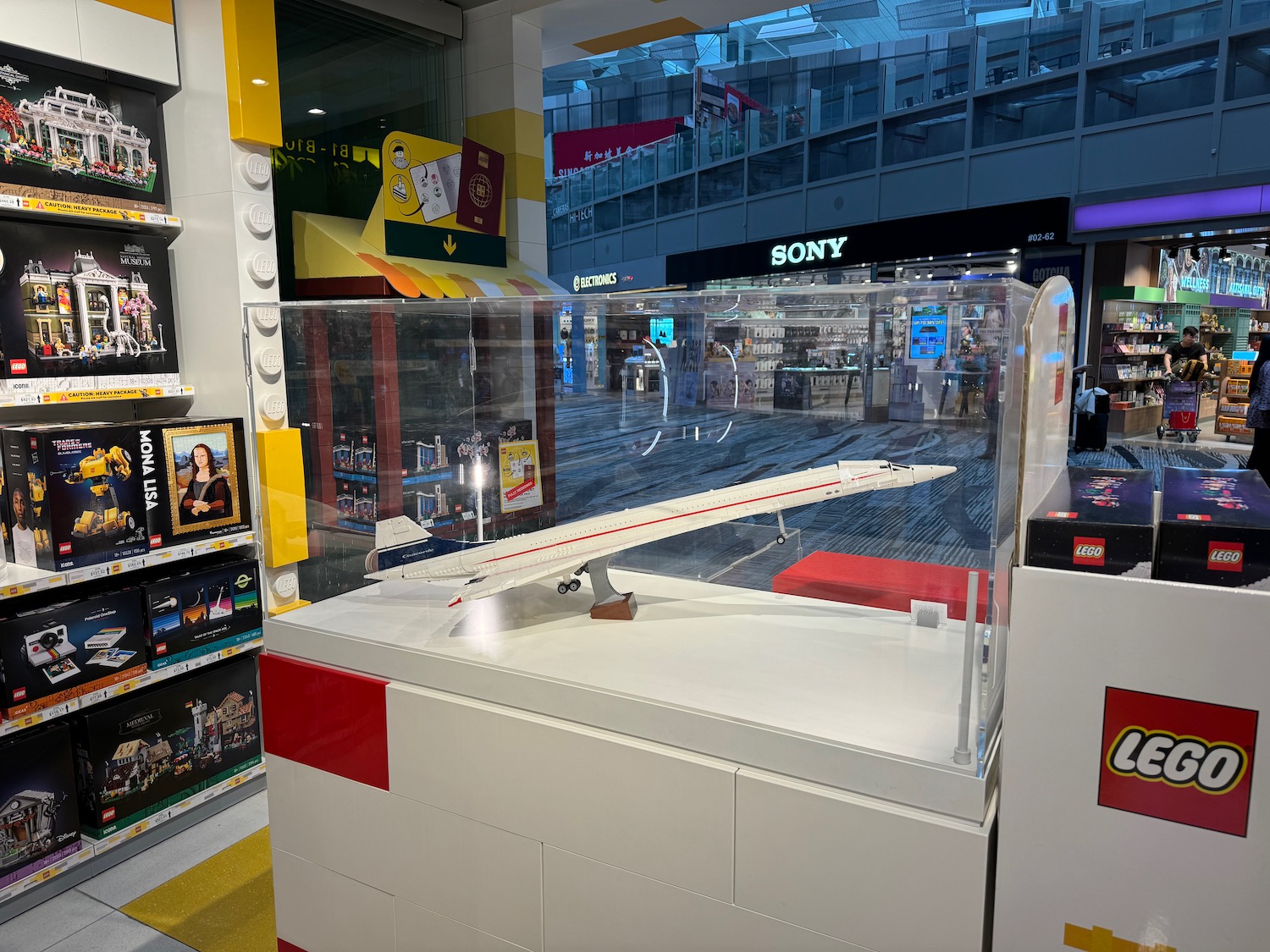 a white and red display case in a mall