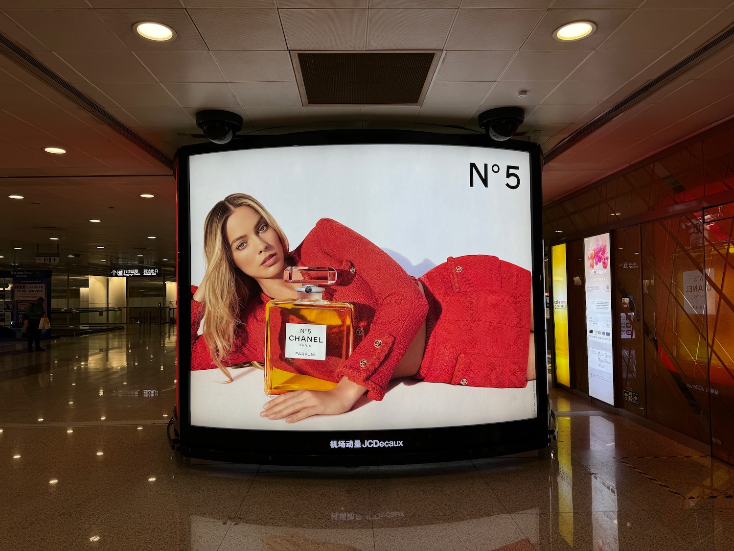 a large screen with a woman on it