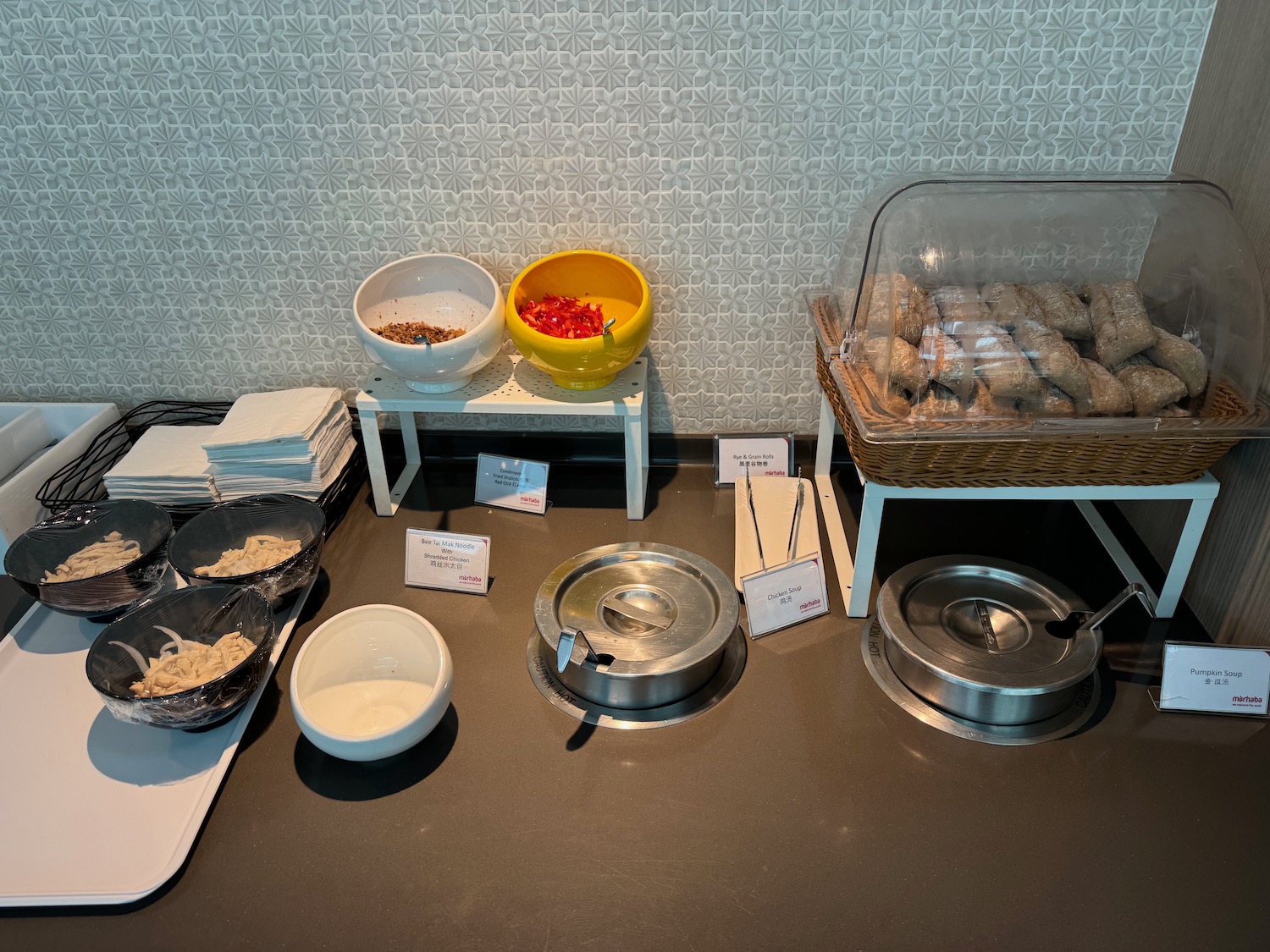 a table with bowls and bowls of food