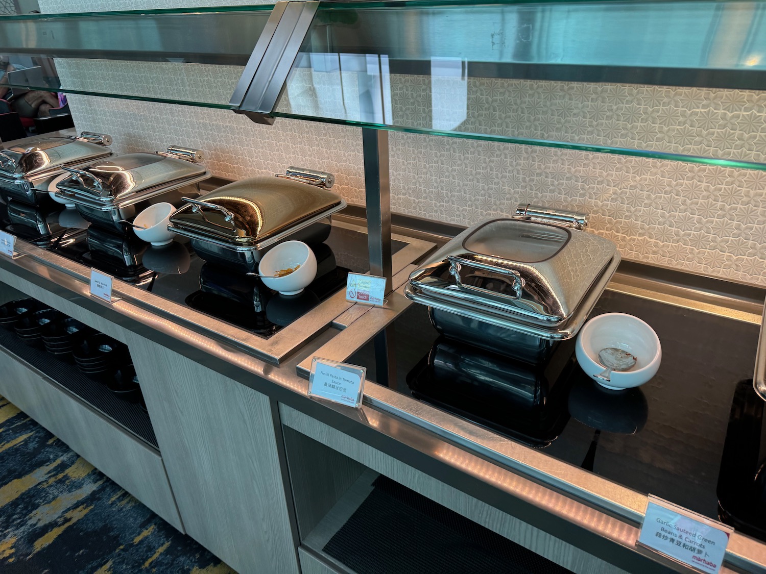 a buffet line with food containers