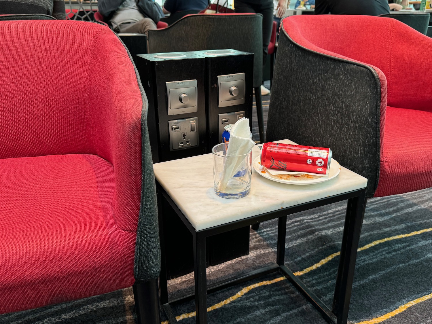 a table with a napkin and a plate of food on it