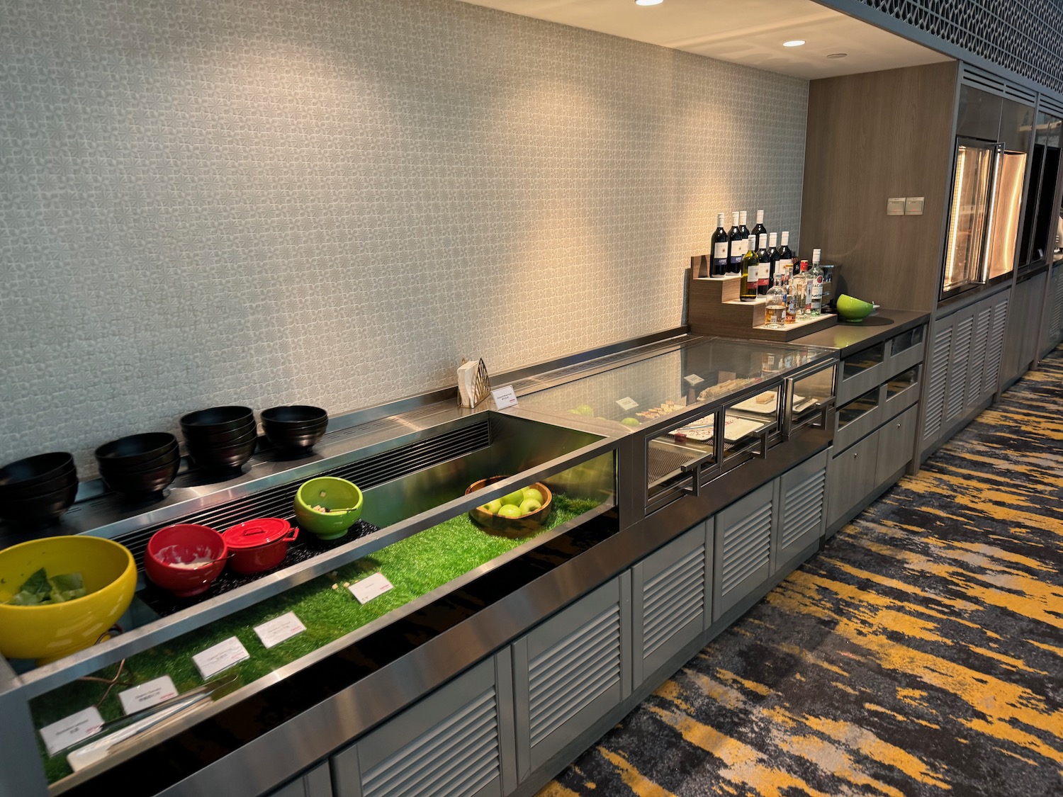 a kitchen with a counter and shelves