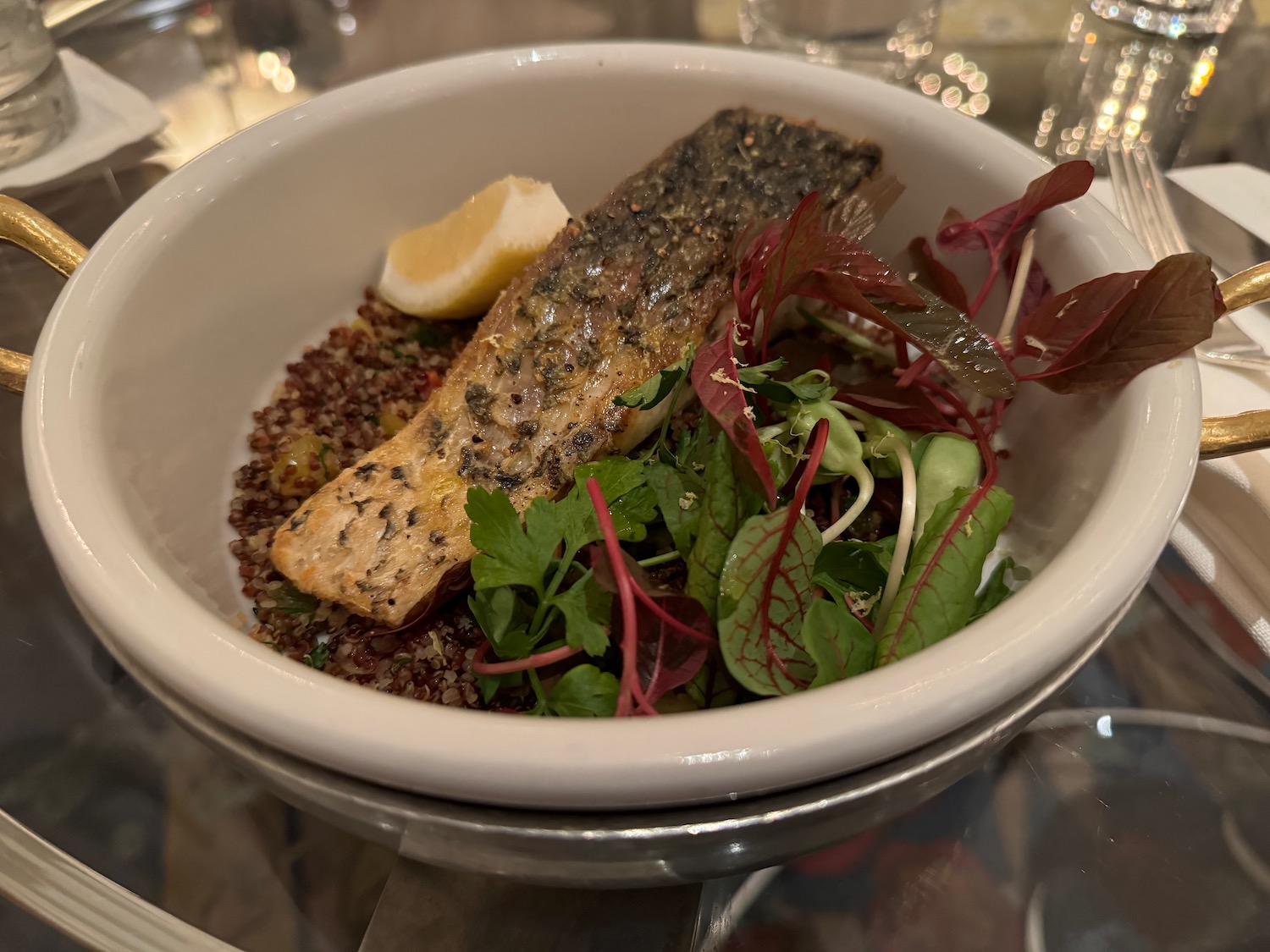 a bowl of food with a slice of lemon