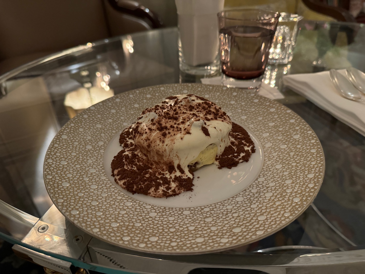 a plate of dessert on a glass table