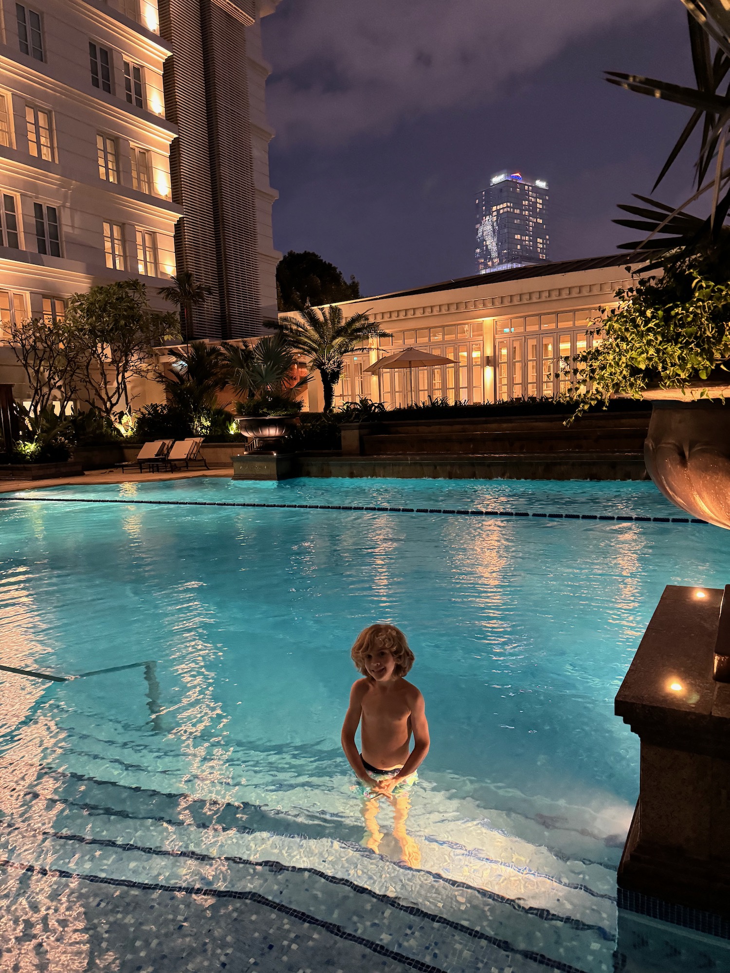 a boy in a swimming pool