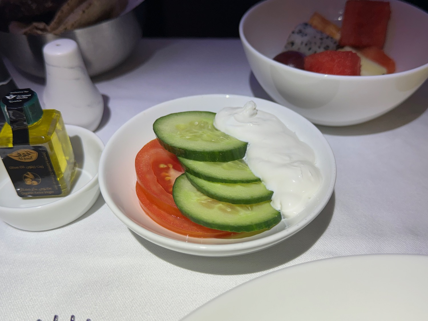 a bowl of cucumbers and tomatoes