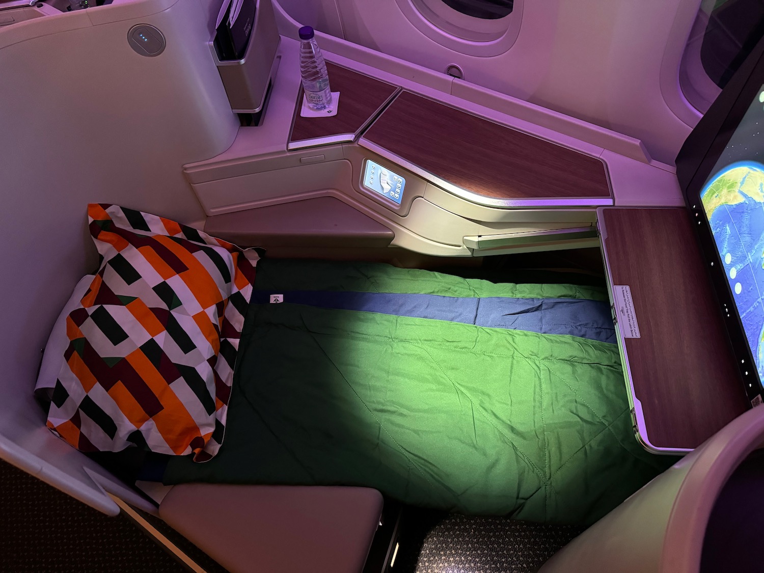 a bed and a table in a plane