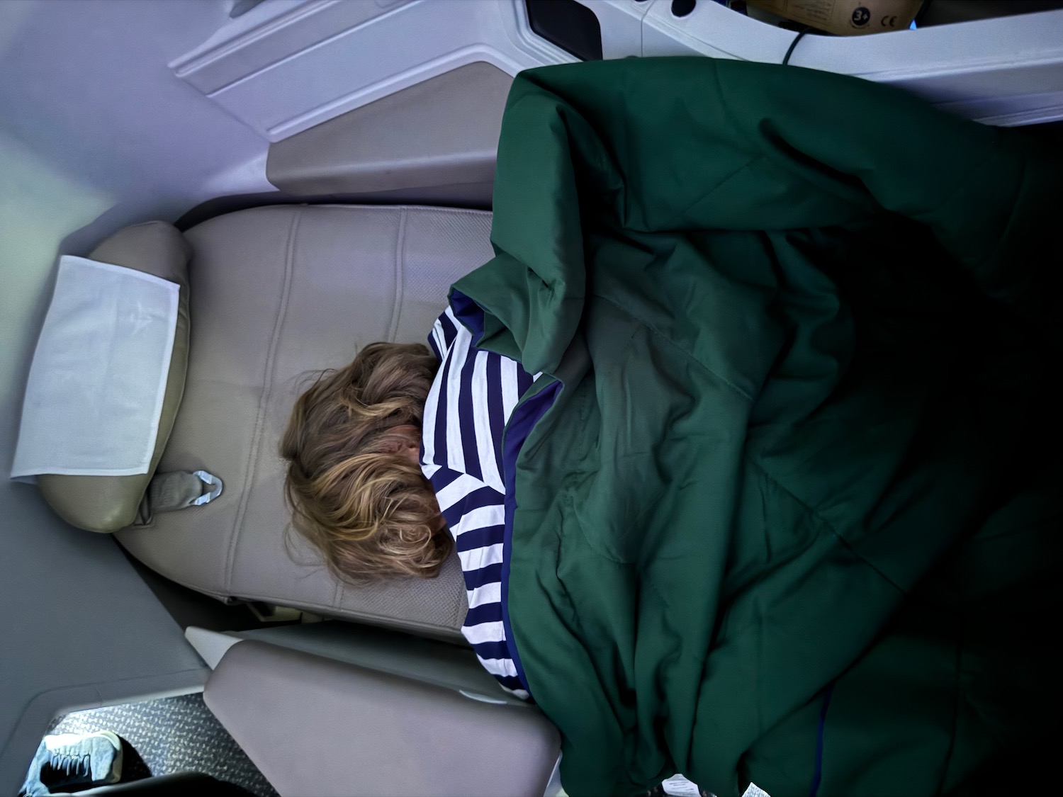 a person sleeping in a car