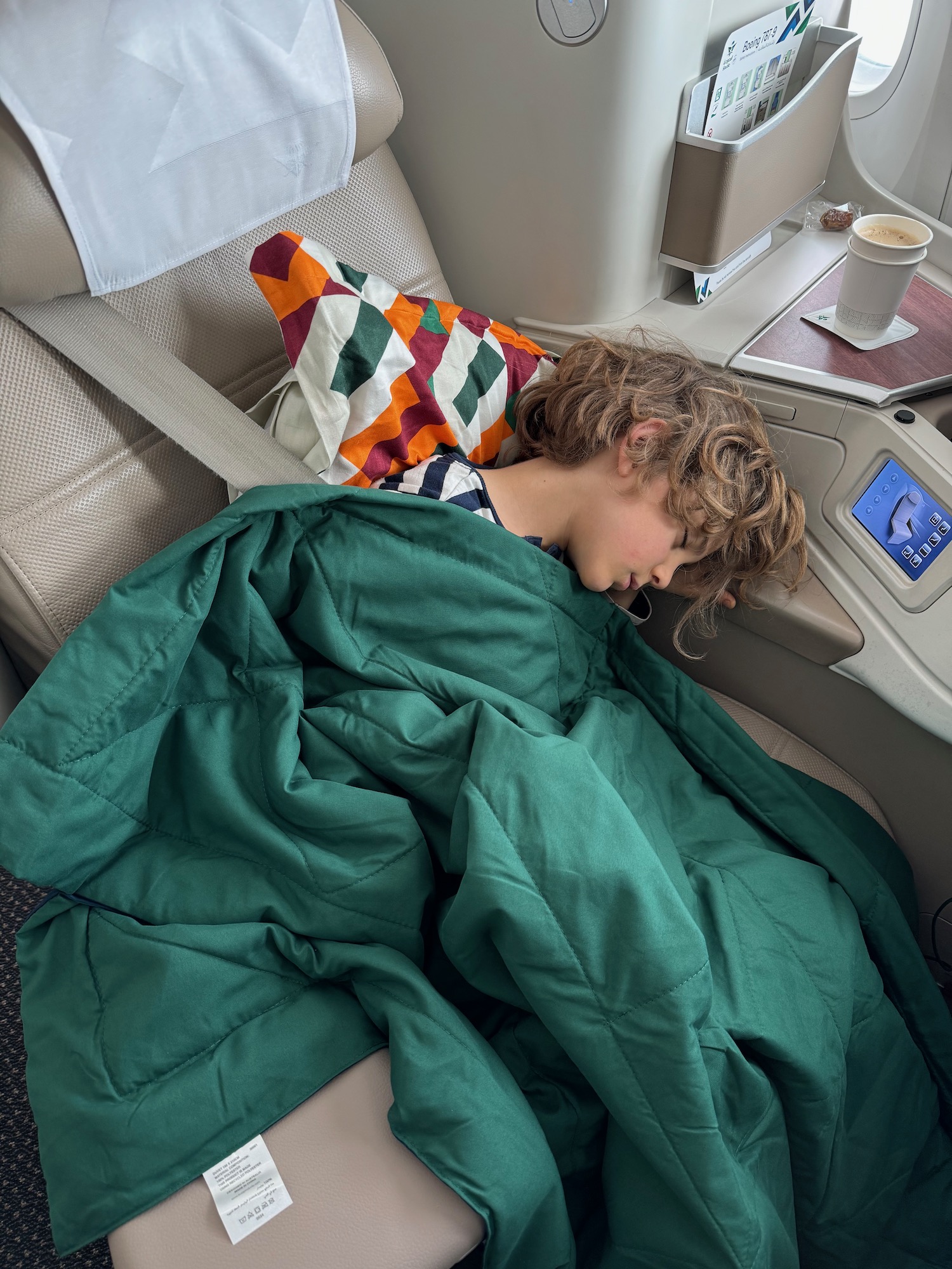 a child sleeping in a chair