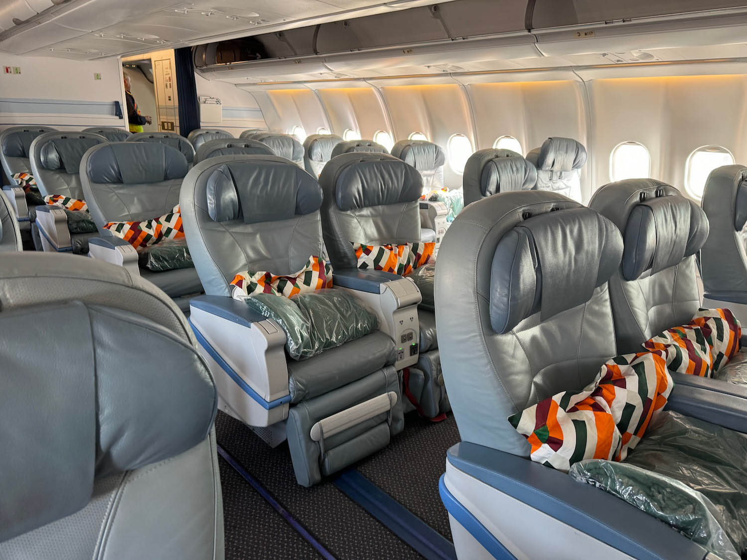 the inside of an airplane with many seats