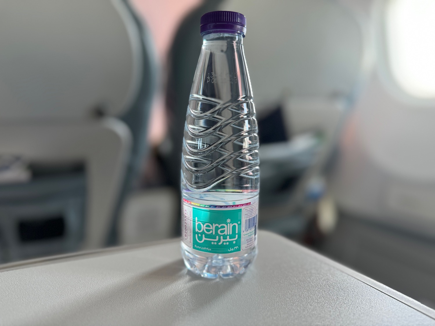 a plastic bottle of water on a table