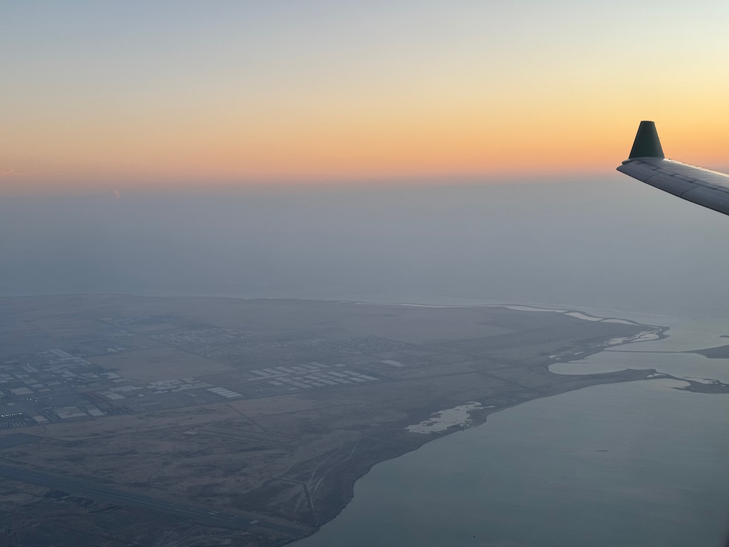 an airplane flying over a body of water