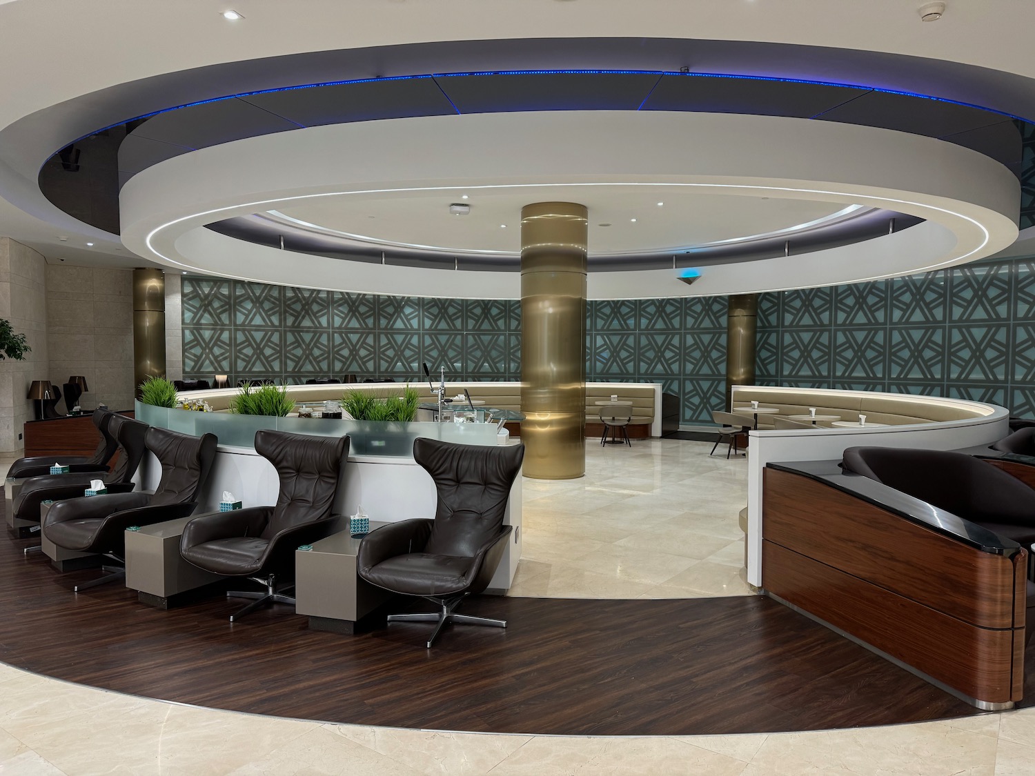 a lobby with chairs and a reception desk