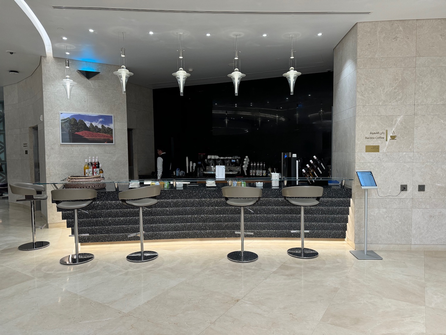 a bar with chairs and a counter