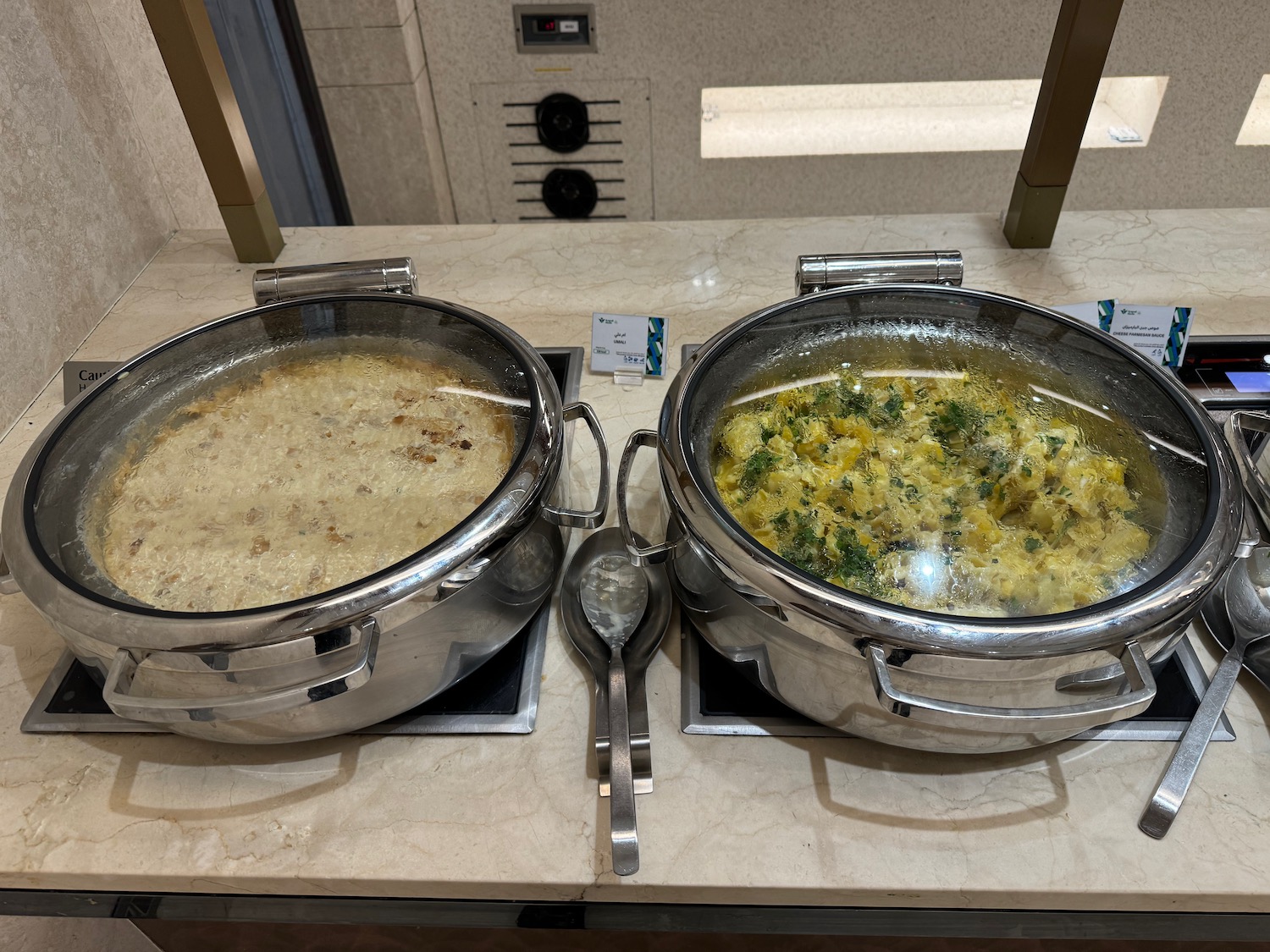 two large pots with food in them