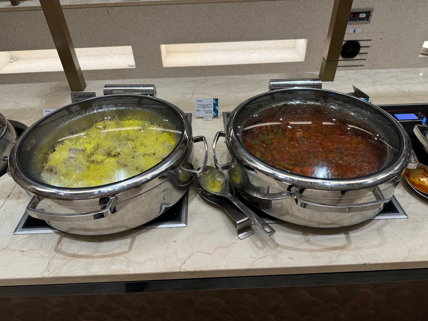 two bowls of food on a counter