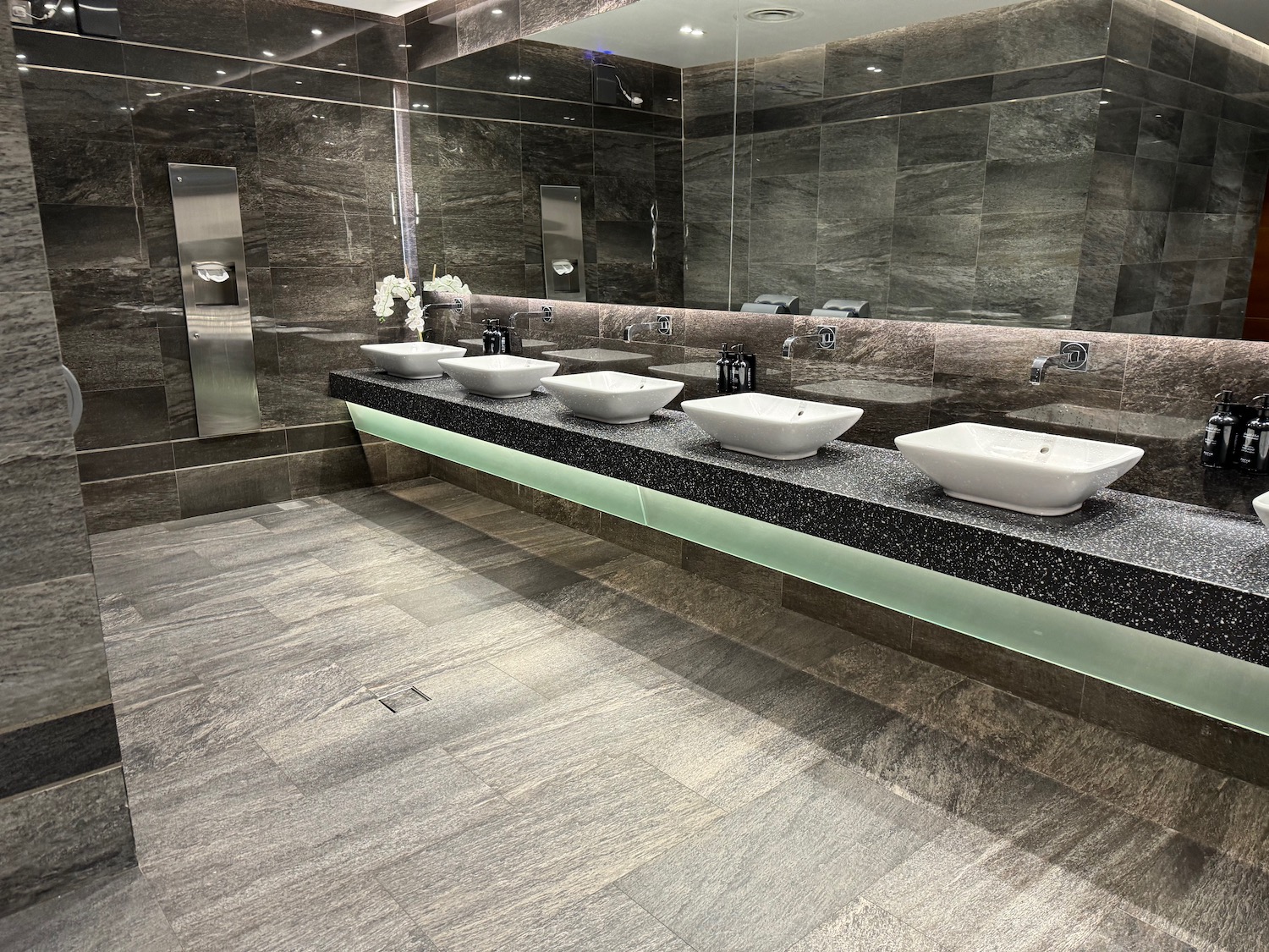 a bathroom with sinks and mirrors