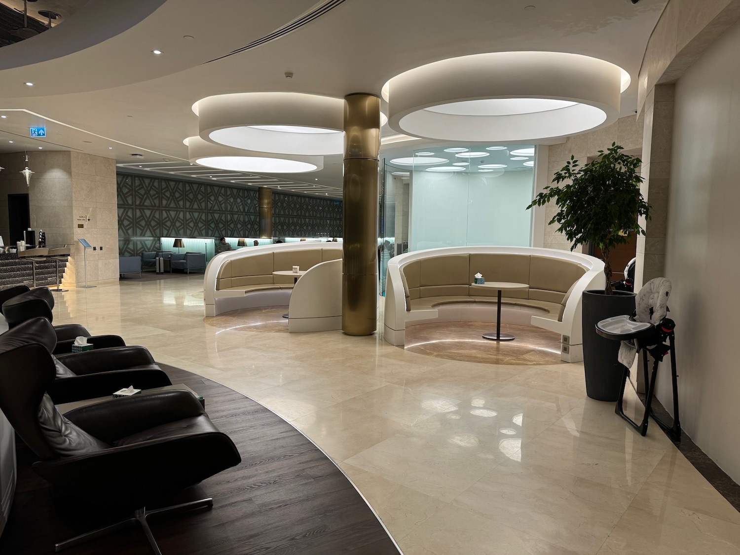 a room with a round ceiling and a round table and chairs