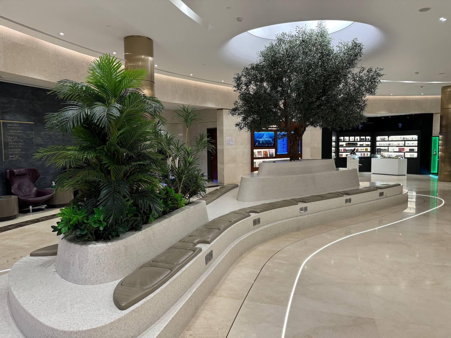 a large indoor planter with trees in a building