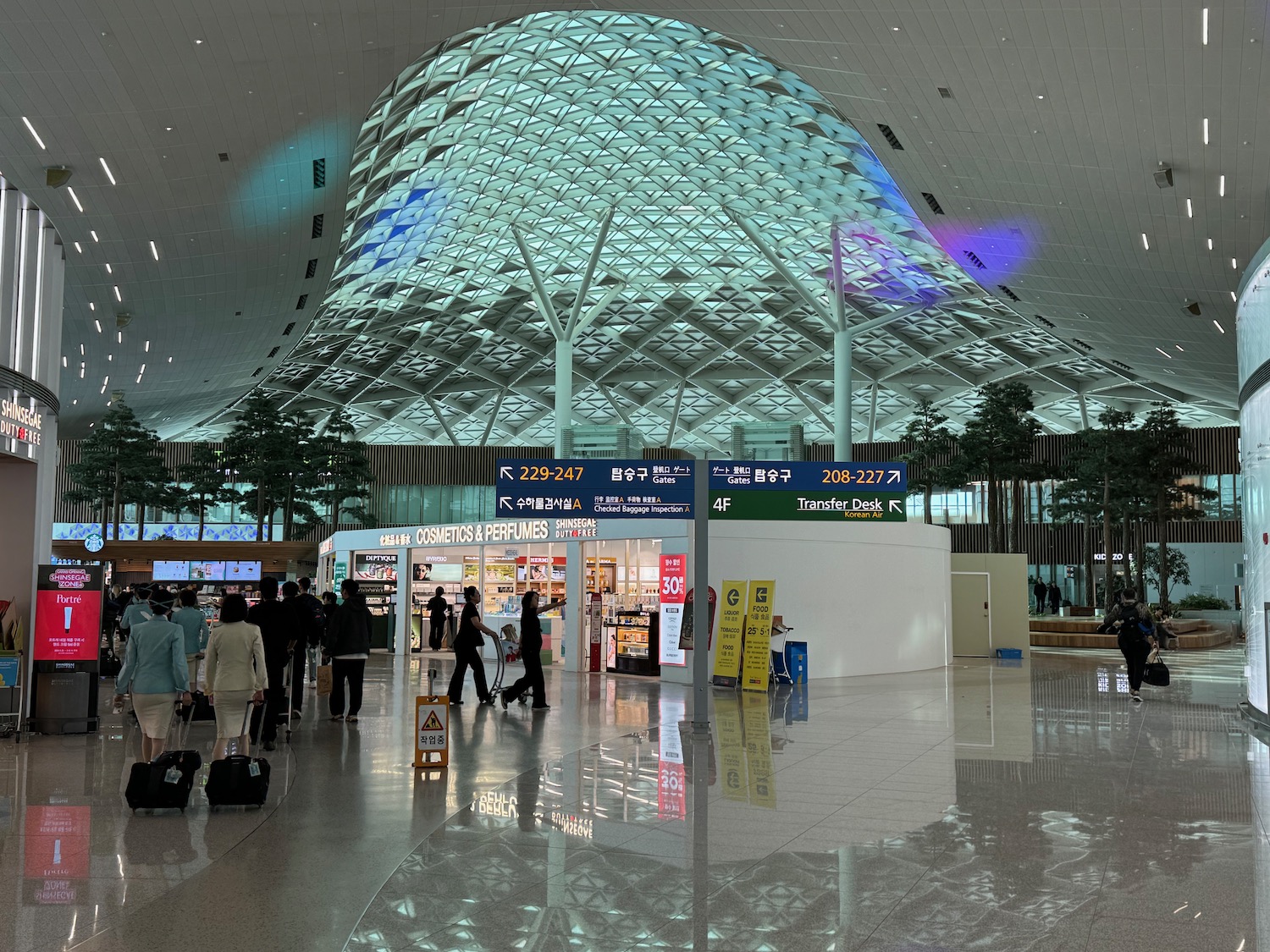 people walking in a large airport