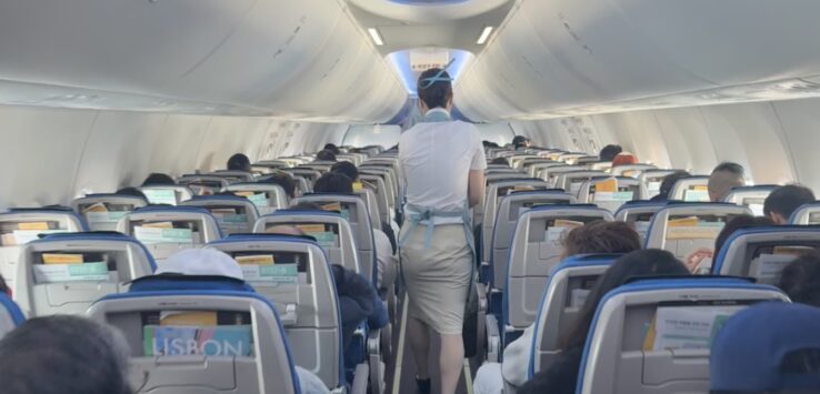 a person walking in an airplane