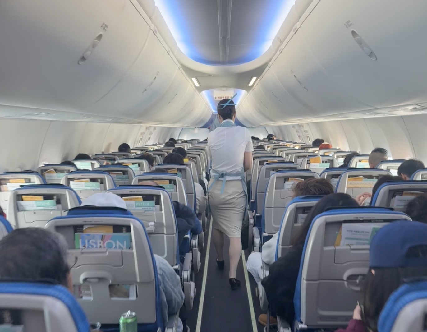 a person walking in an airplane