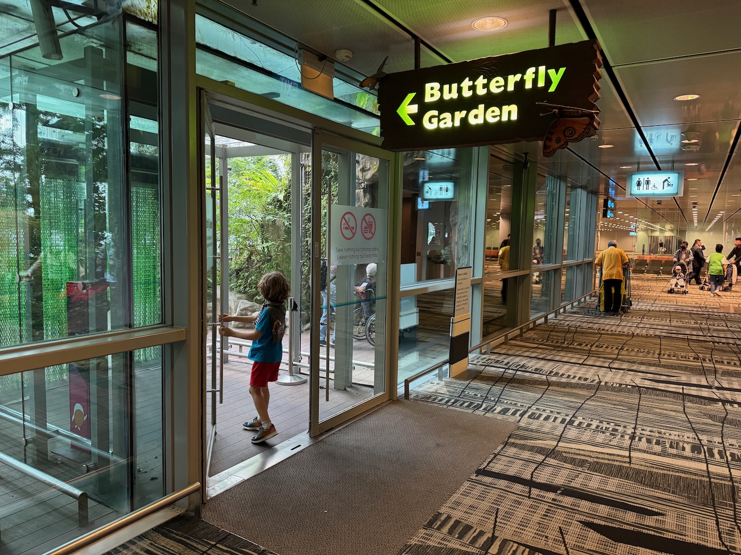 a child opening a glass door