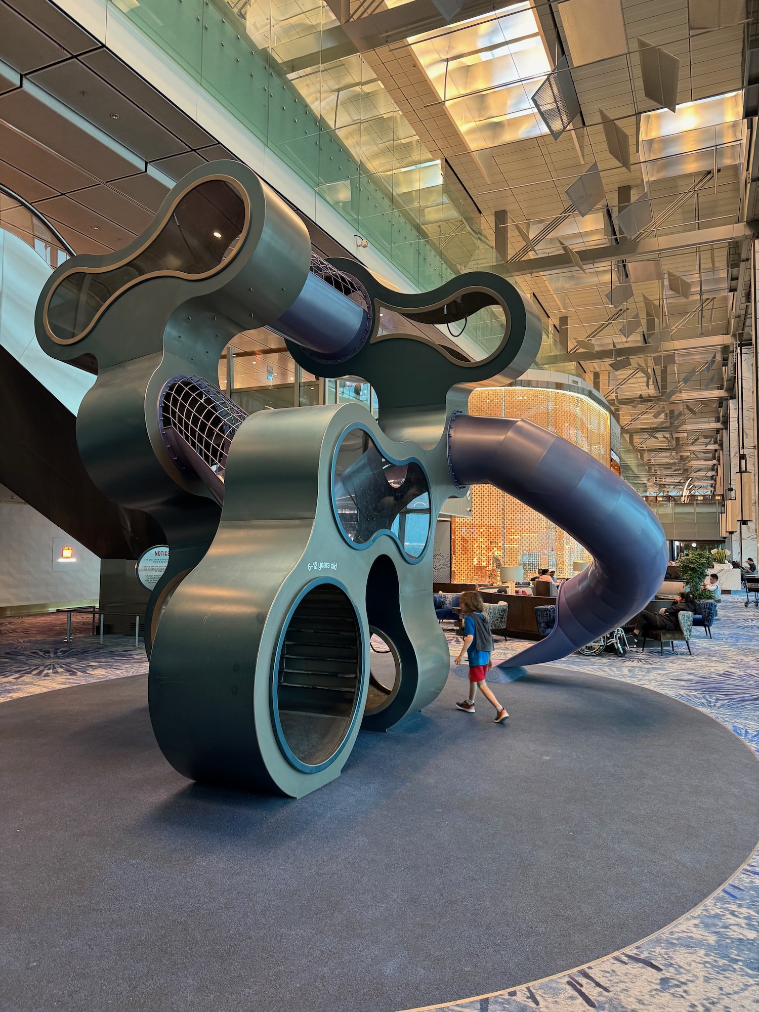 a child walking in a large structure