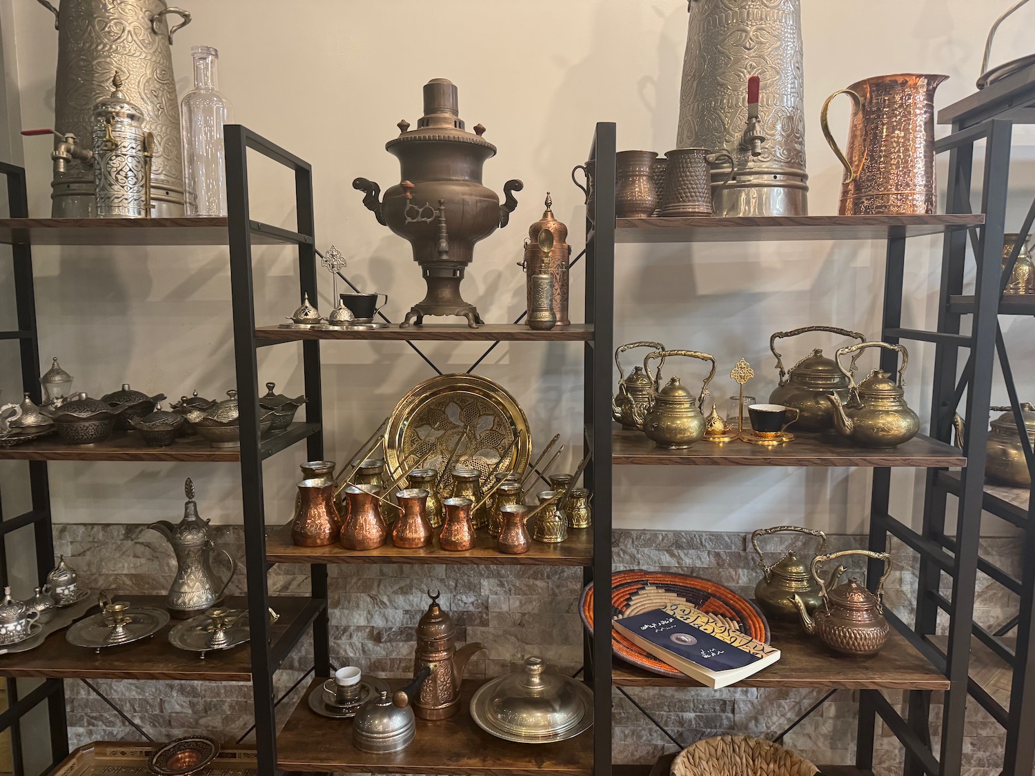 a shelf with metal objects on it