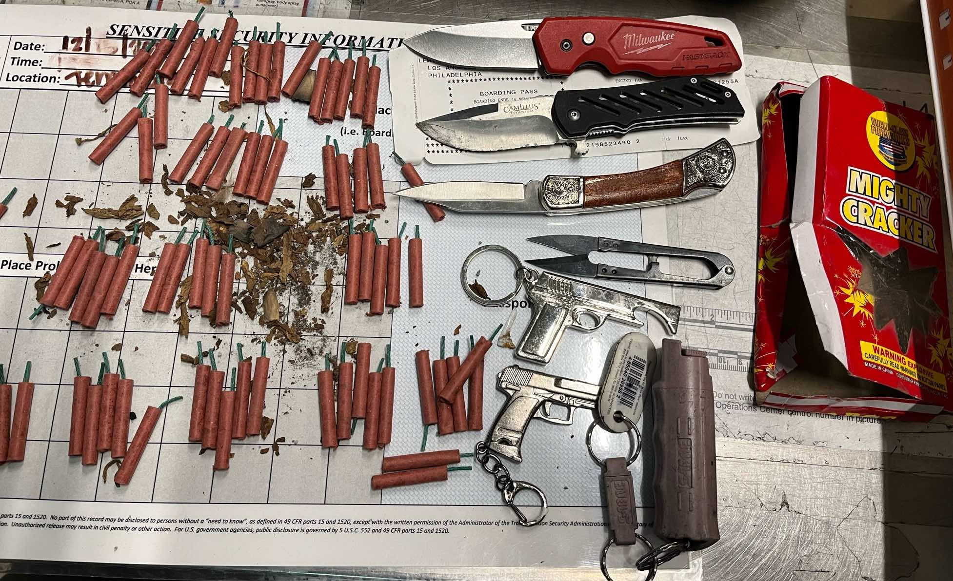 a group of knives and firecrackers on a table