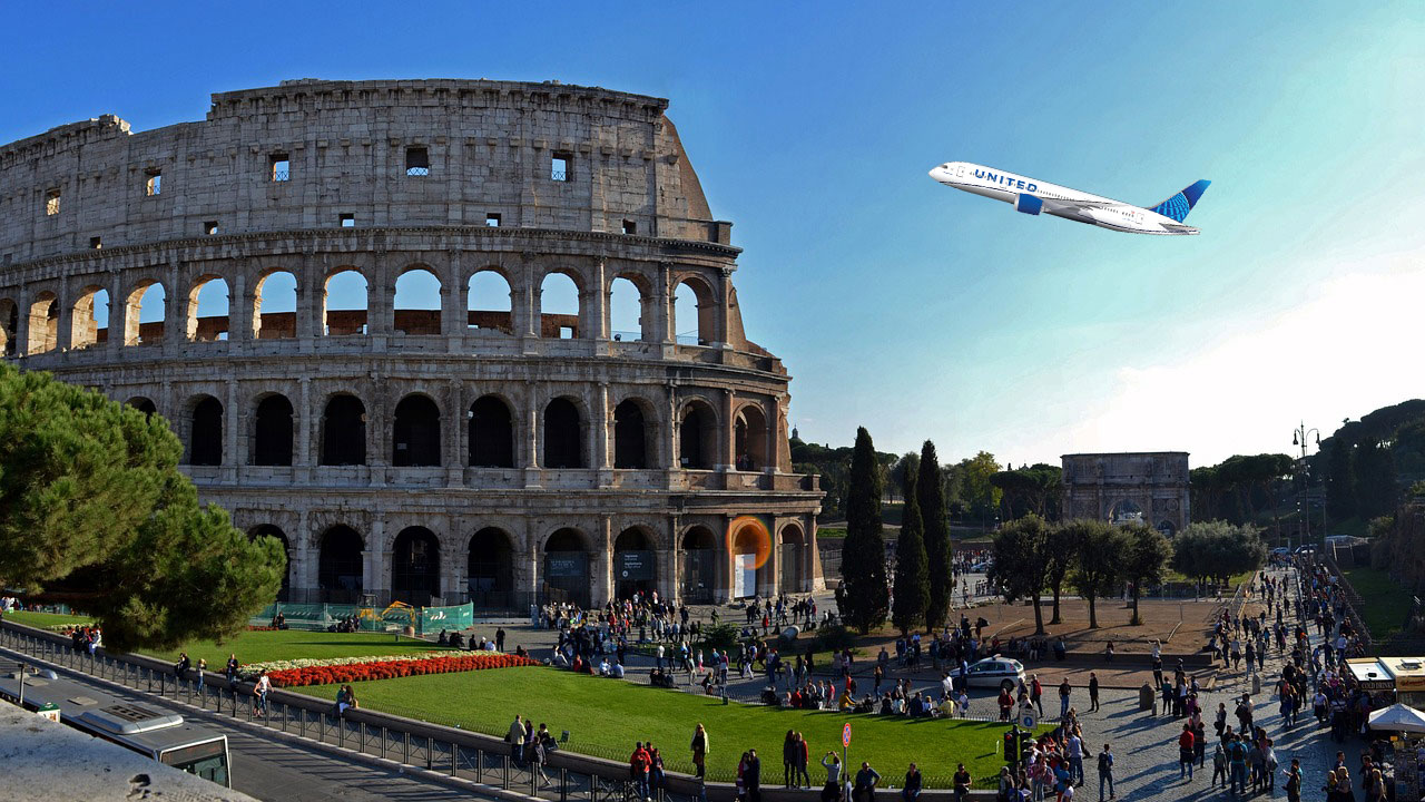 a plane flying over a large stone building with Colosseum in the background