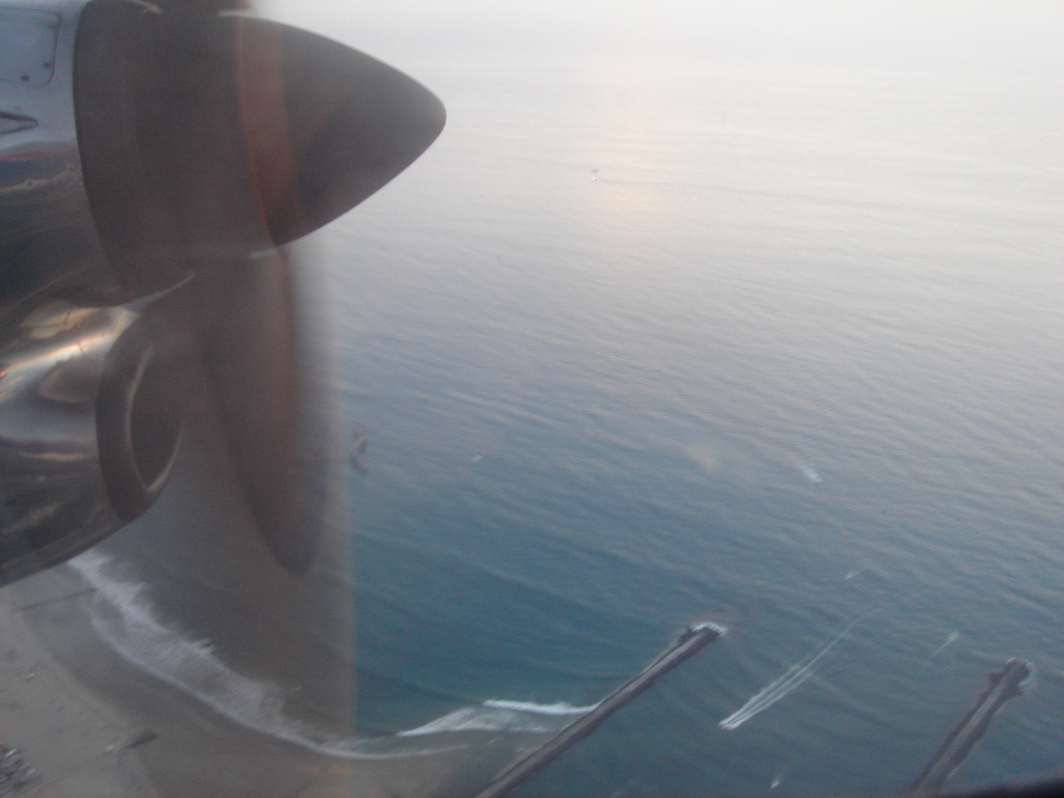 a view of the ocean from an airplane window