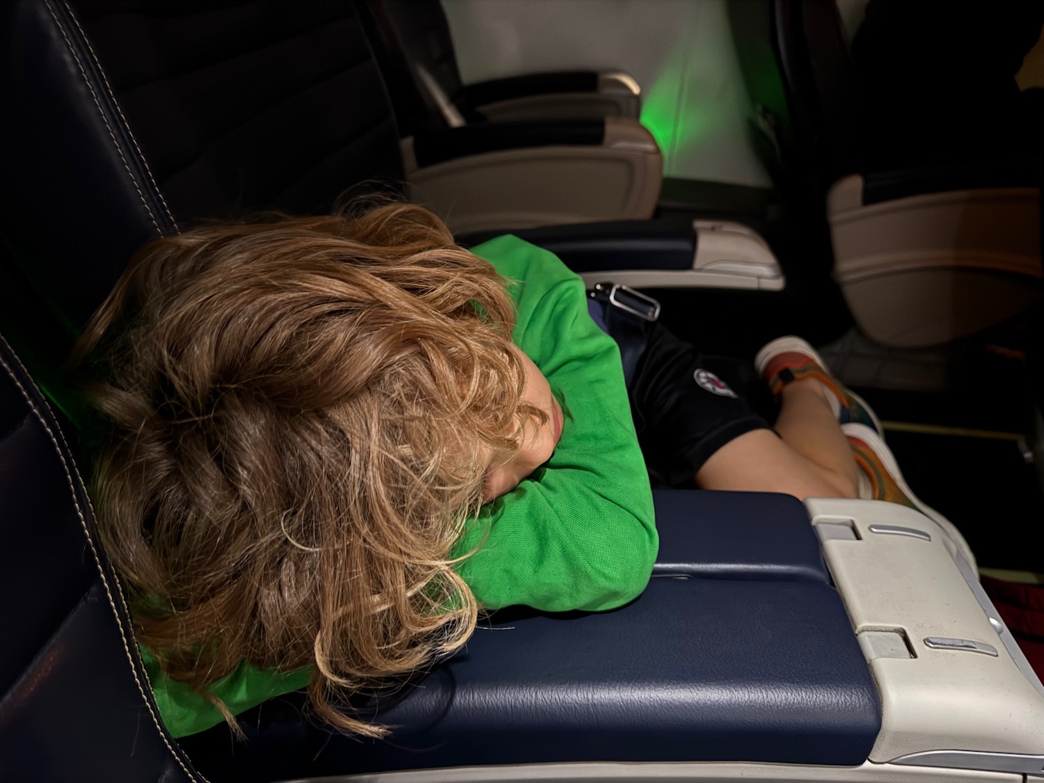 a person sleeping on a seat