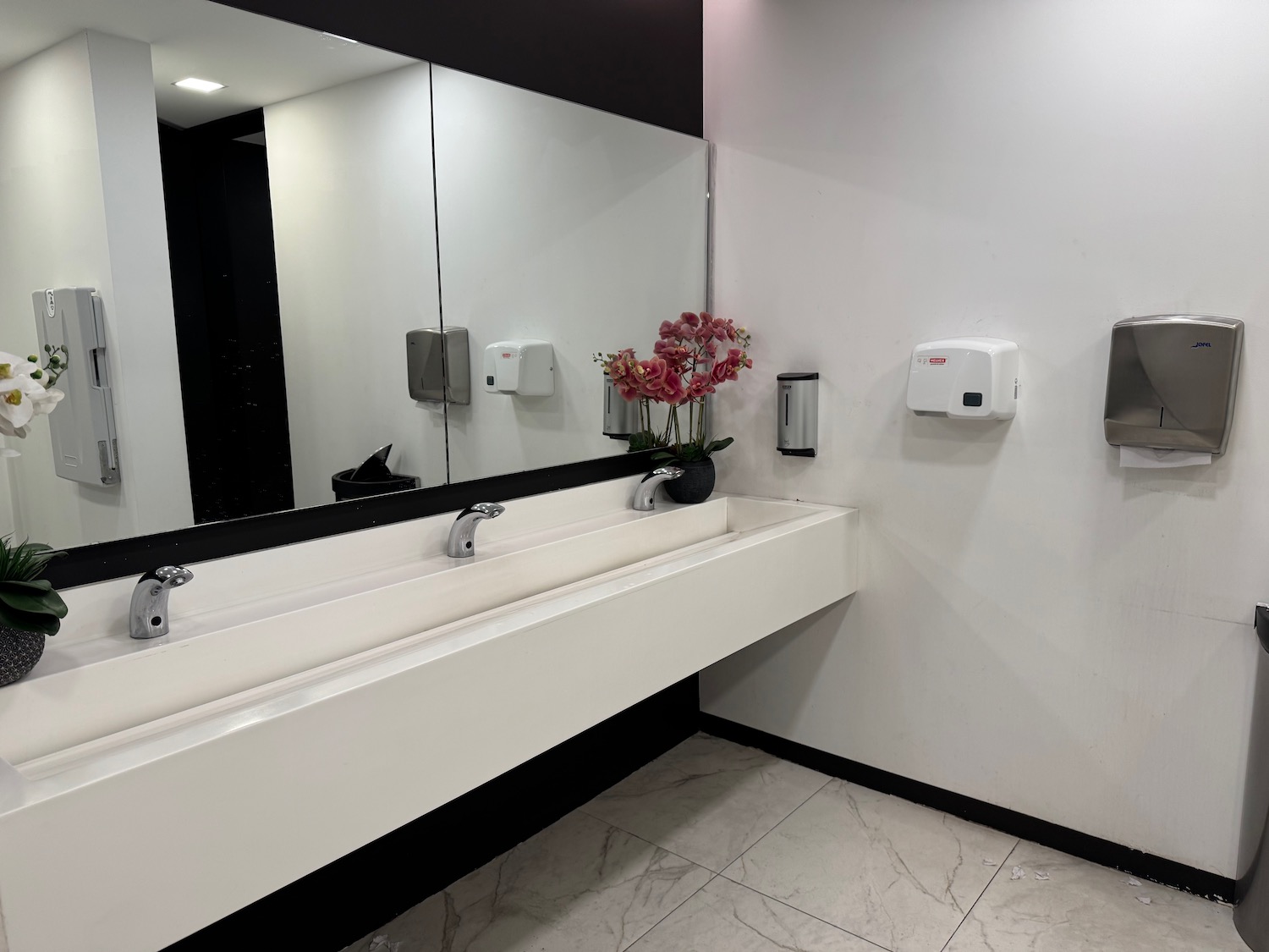 a bathroom with a mirror and sinks