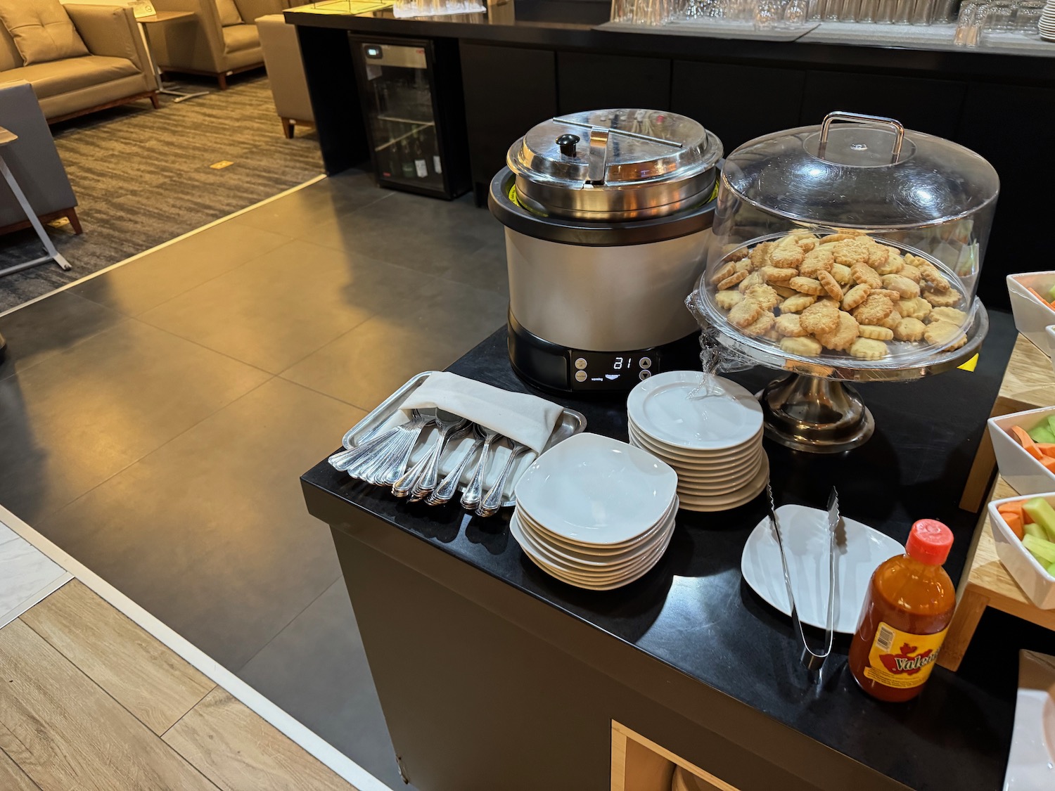 a buffet table with plates and food on it