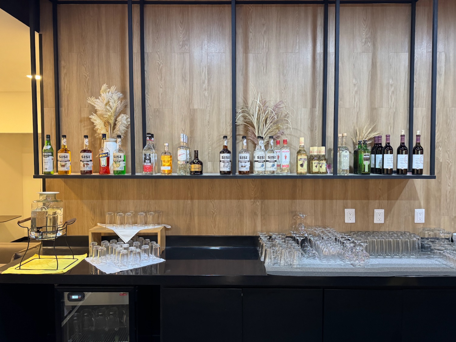 a bar with bottles and glasses