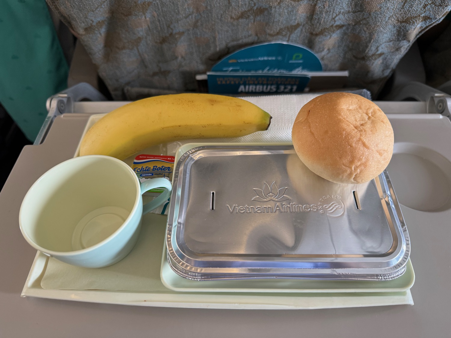 a tray with food and a banana on it