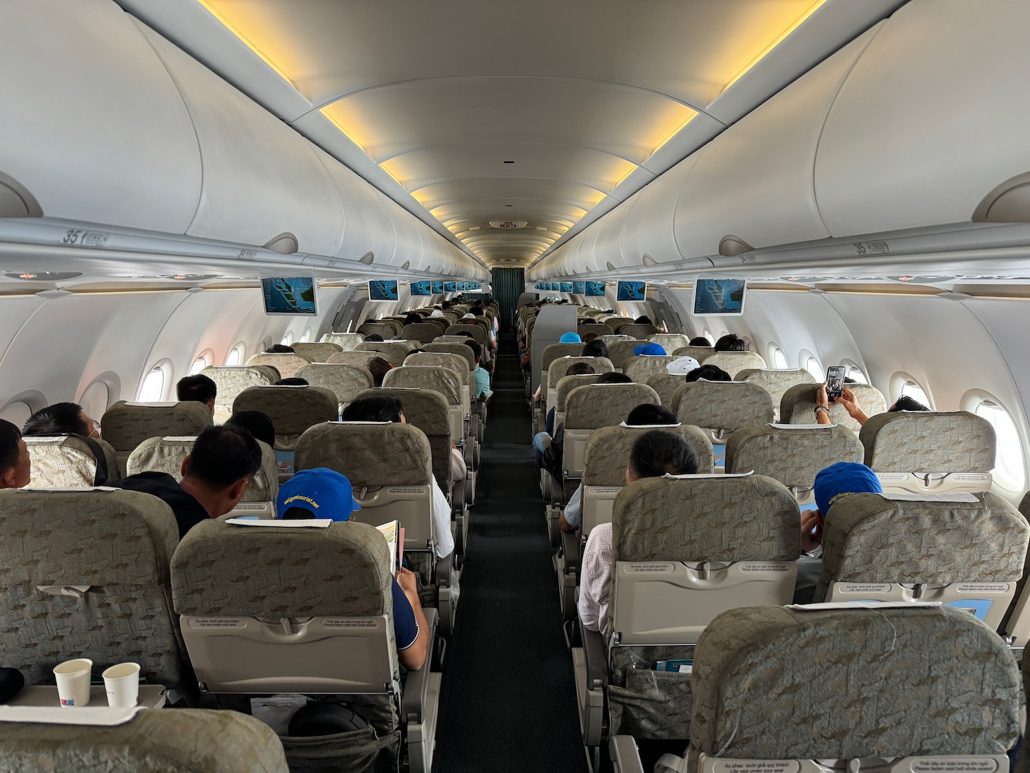 a group of people sitting in an airplane