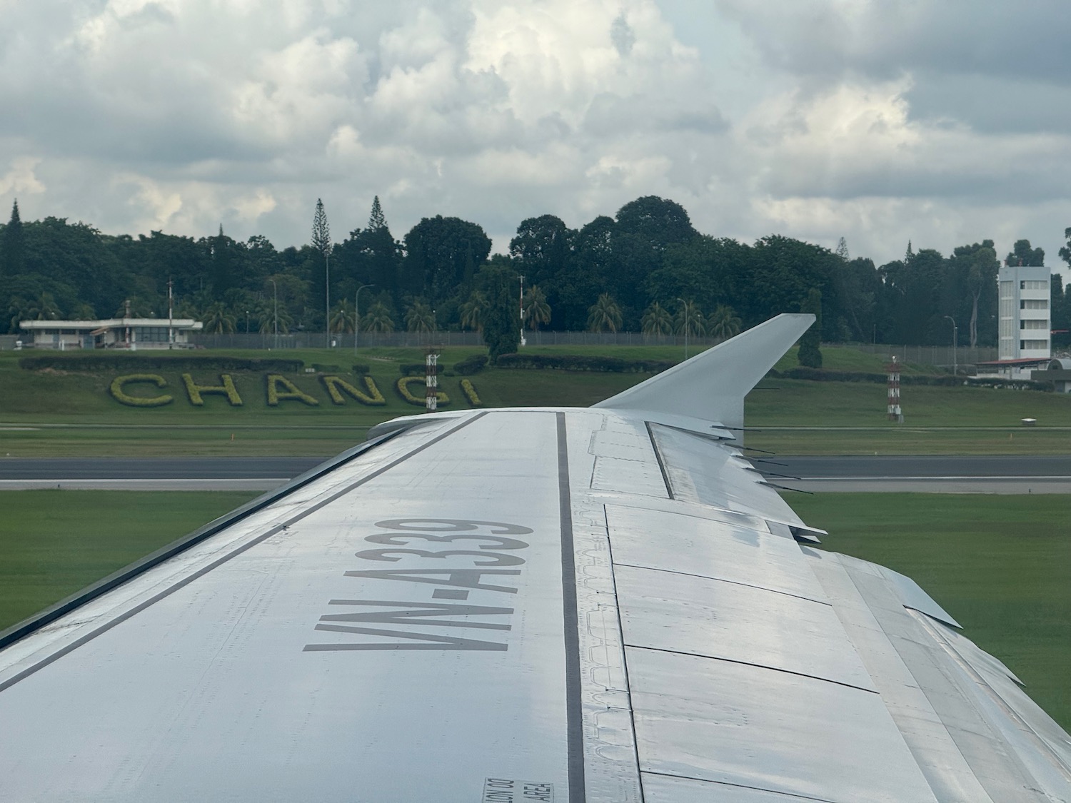 the wing of an airplane on a runway