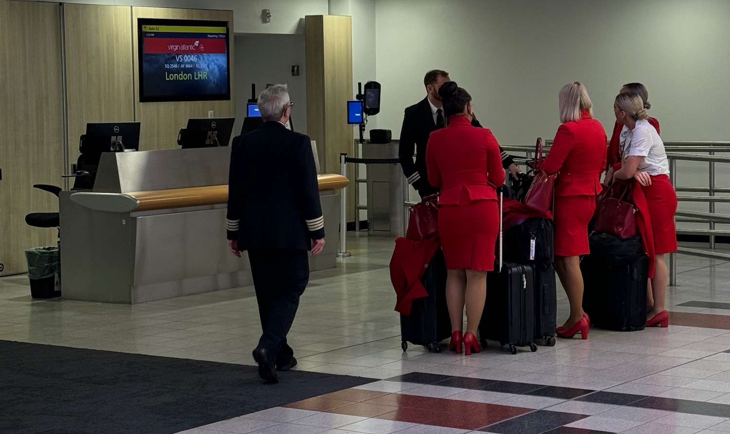 a group of people in red uniforms