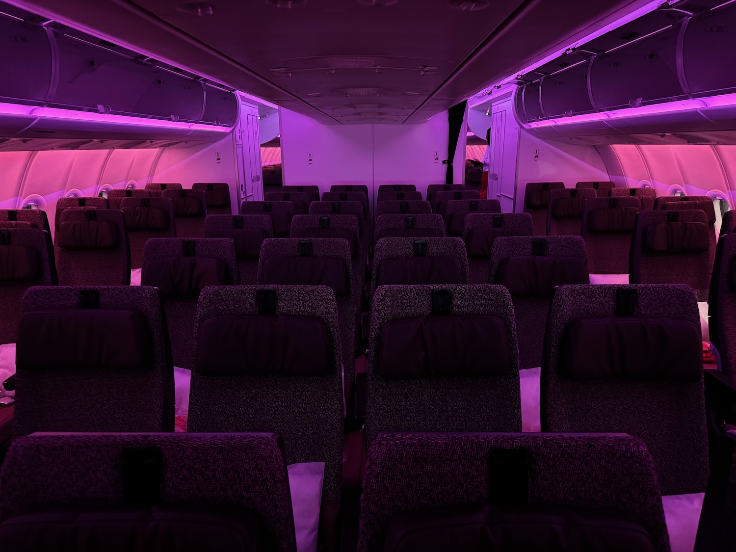 an airplane with purple lights