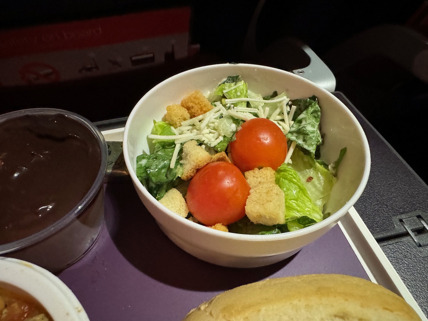 a bowl of salad on a tray