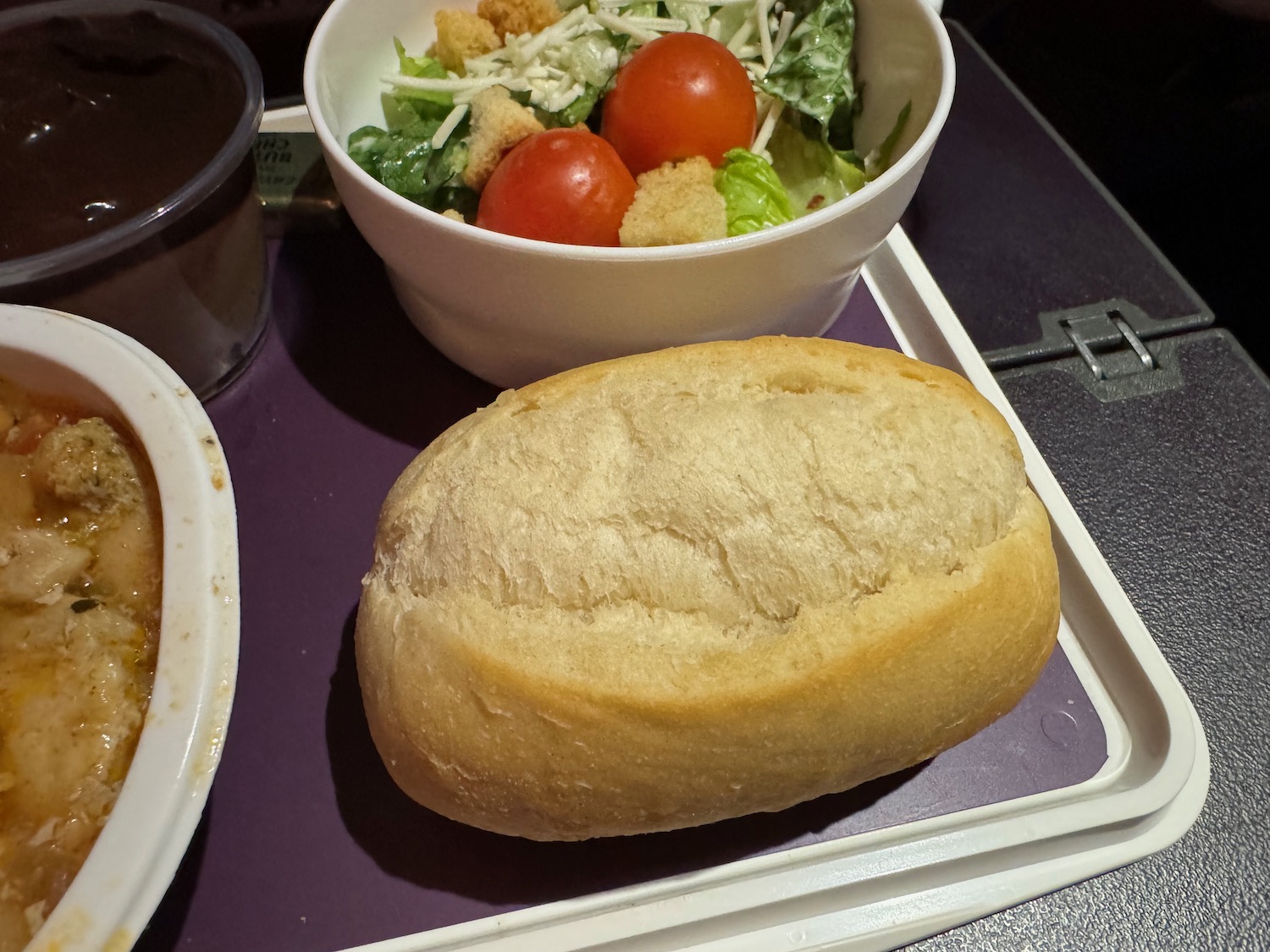 a loaf of bread and a bowl of salad