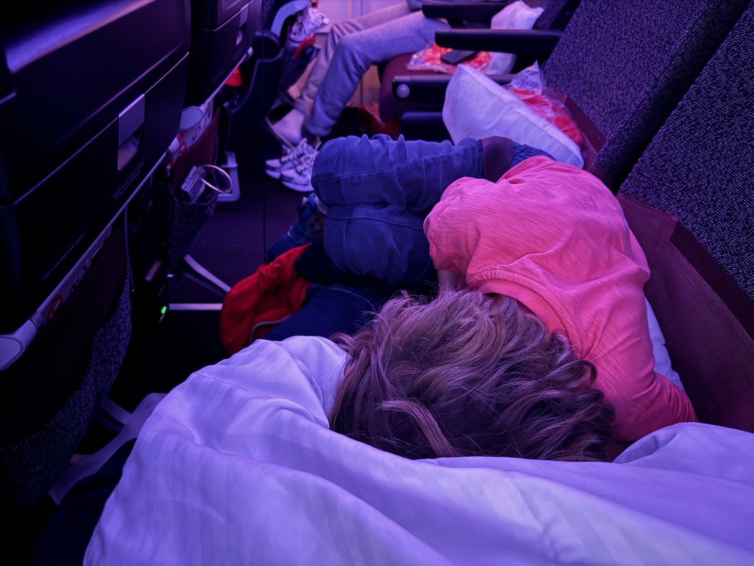 a person sleeping on a plane