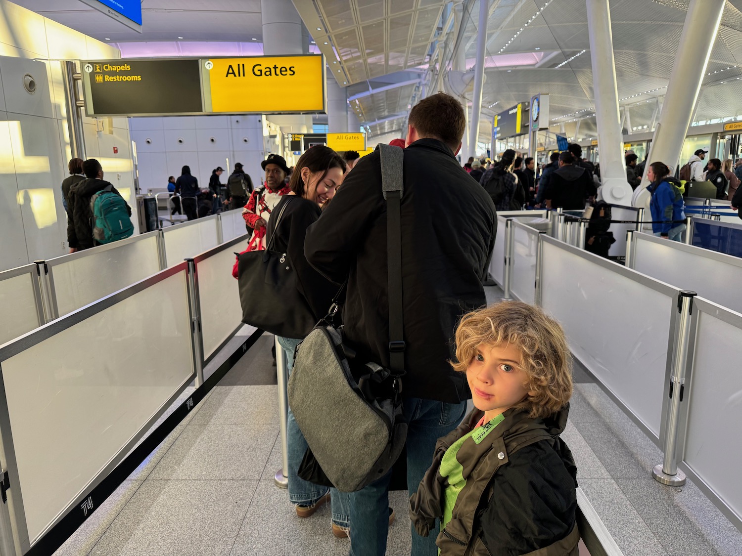 a group of people standing in an airport