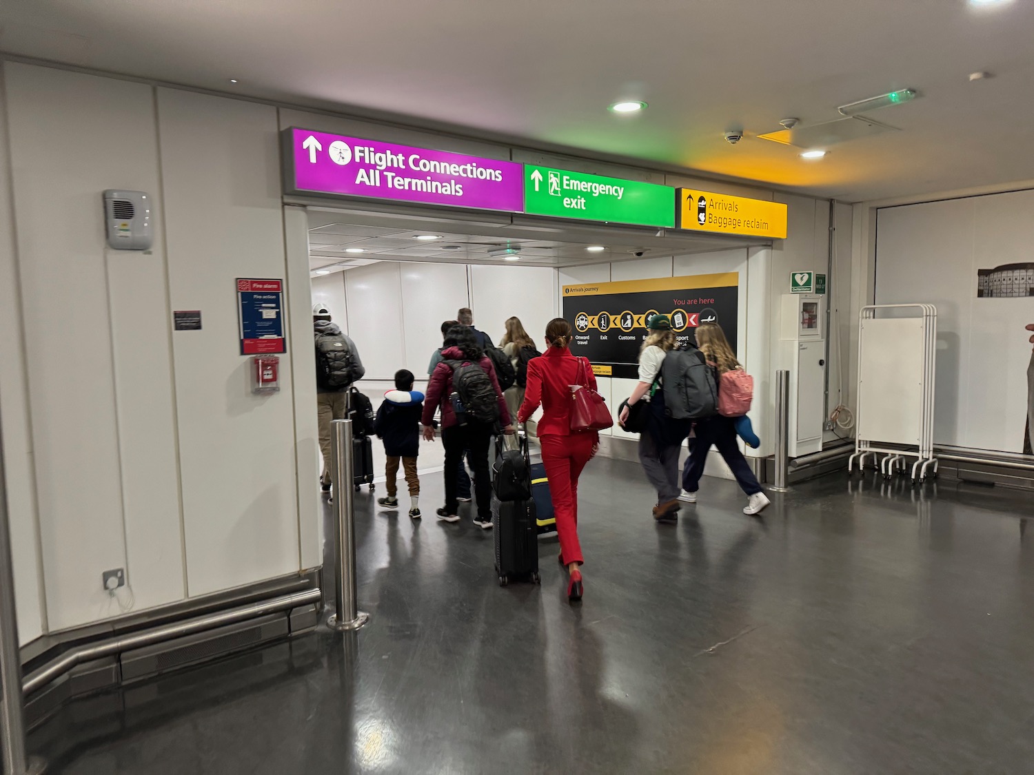 a group of people walking in an airport