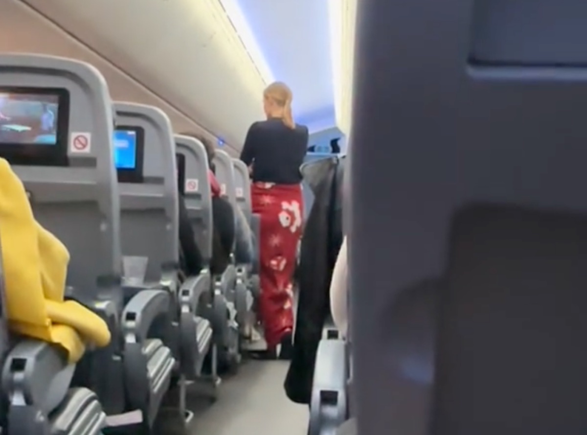 a woman walking on an airplane