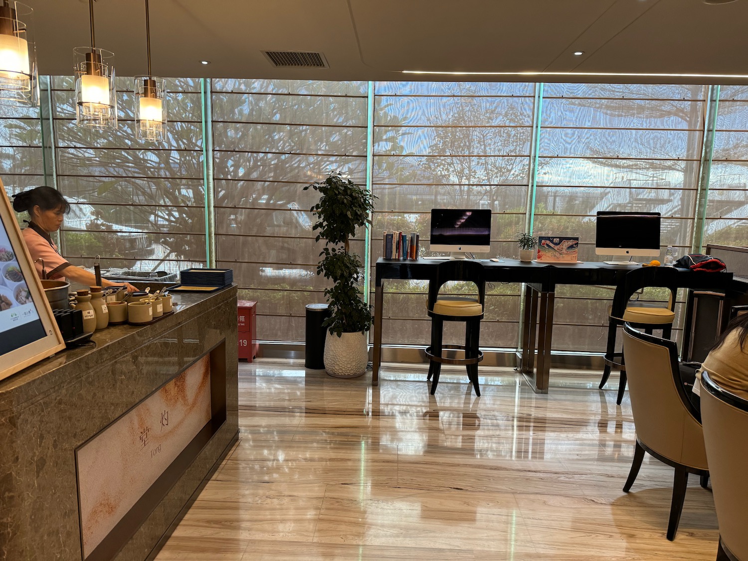 a room with a table and chairs and a window