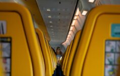 a row of yellow seats on an airplane