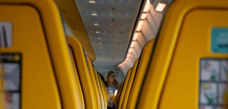 a row of yellow seats on an airplane